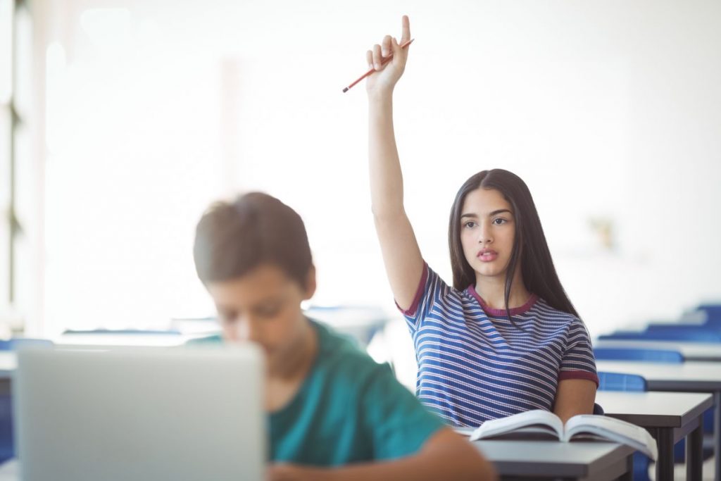 Student Raising Her Hand To Ask Questions