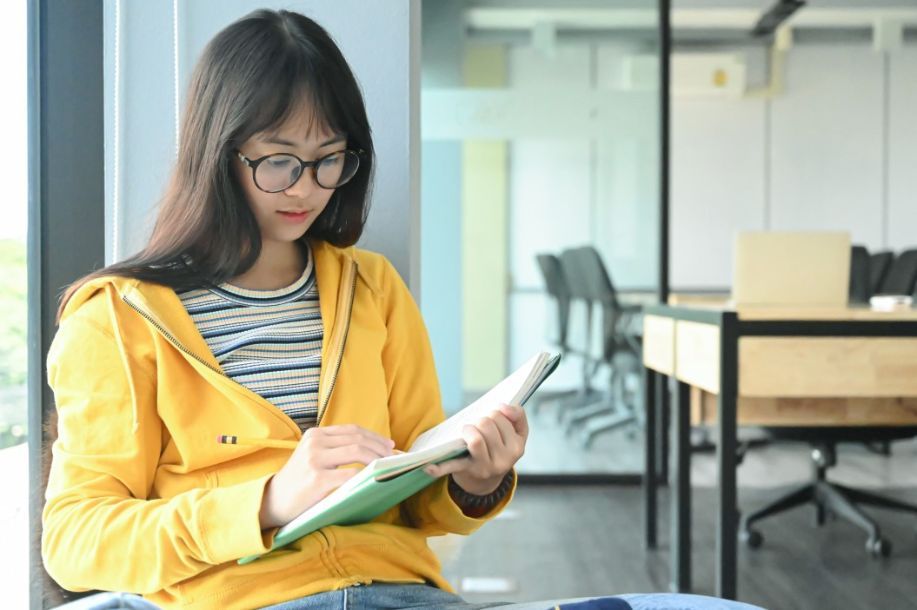 student-completing-her-chemistry-assignment-during-chemistry-tuition